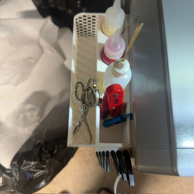 Embroidery tools organized for a Melco