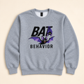 Heather gray Bat Behavior embroidered sweatshirt, neatly arranged on a warm ivory studio background