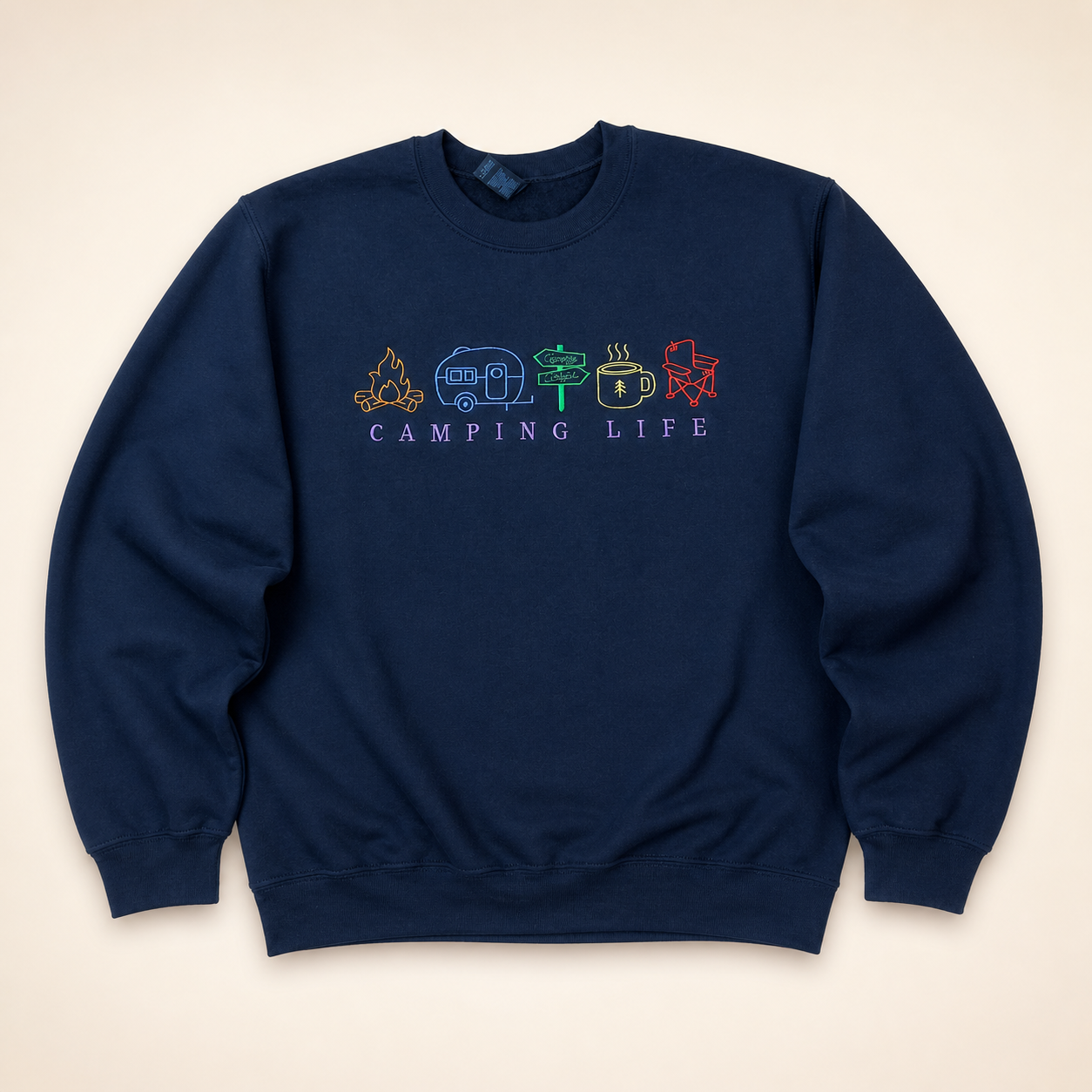 Navy Camping Life embroidered sweatshirt on a warm ivory studio background