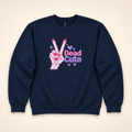 Navy Dead Cute embroidered sweatshirt, neatly arranged on a warm ivory studio background