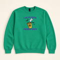 Green Freshly Boo’d Coffee embroidered sweatshirt, neatly arranged on a warm ivory studio background