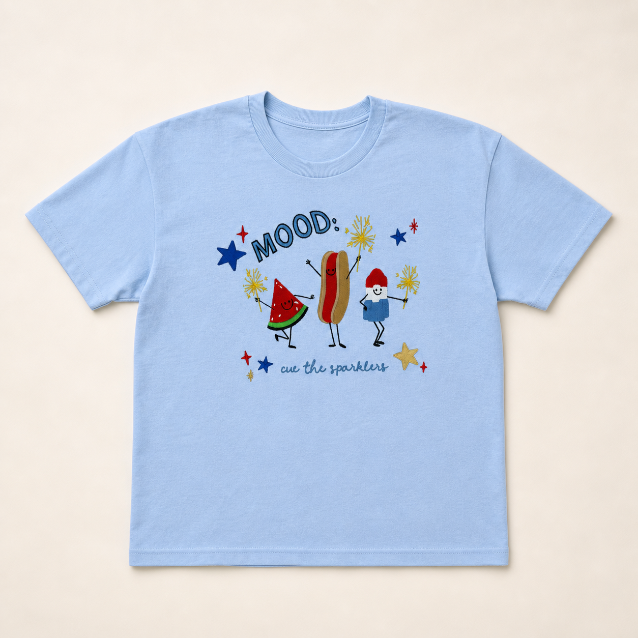 Light-blue Mood Americana embroidered T-shirt on a warm ivory studio background