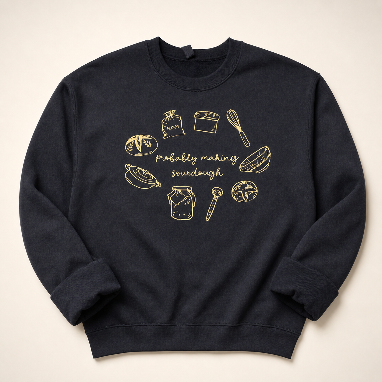 Black sourdough embroidered sweatshirt on a warm ivory studio background