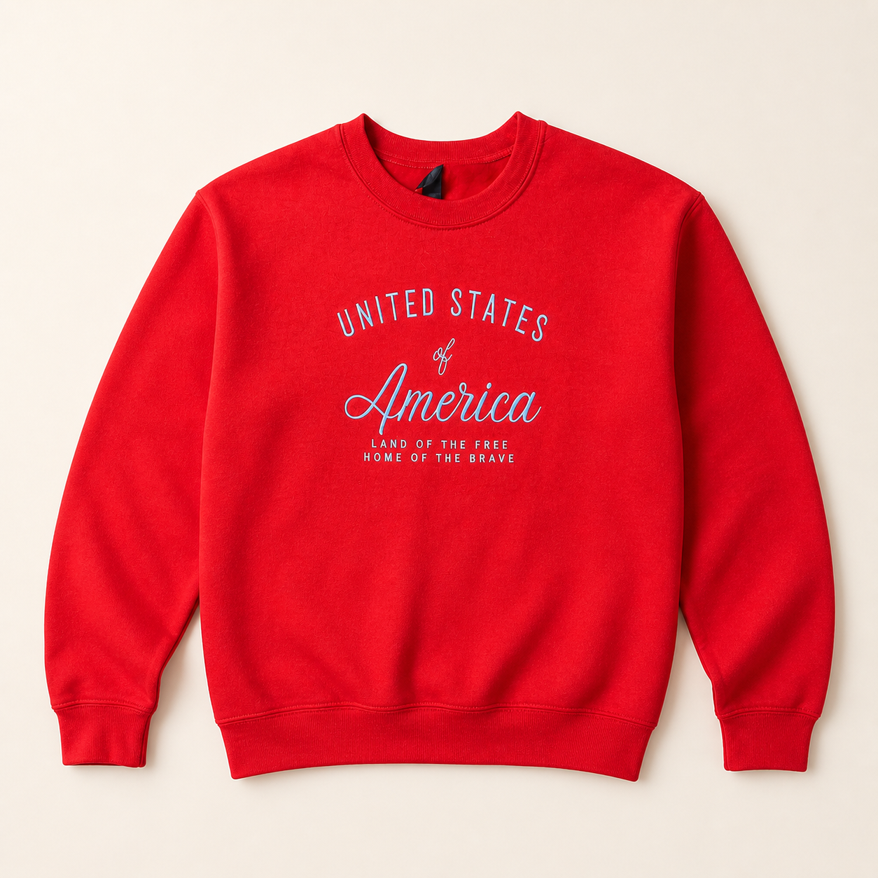 Red United States of America embroidered sweatshirt on a warm ivory studio background